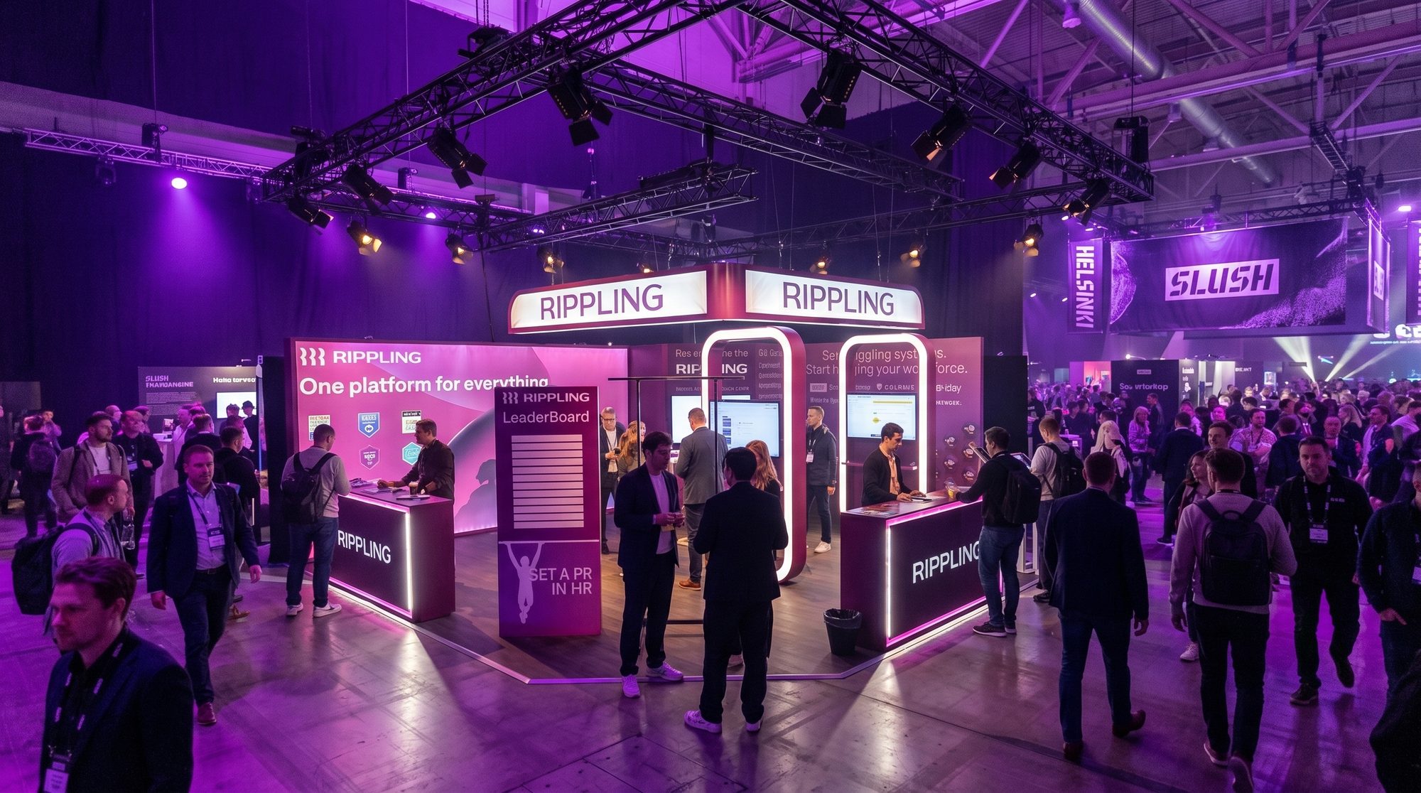The Rippling stand at Slush 2025, Helsinki — a curved island stand with backlit header, demo screens and crowds of attendees